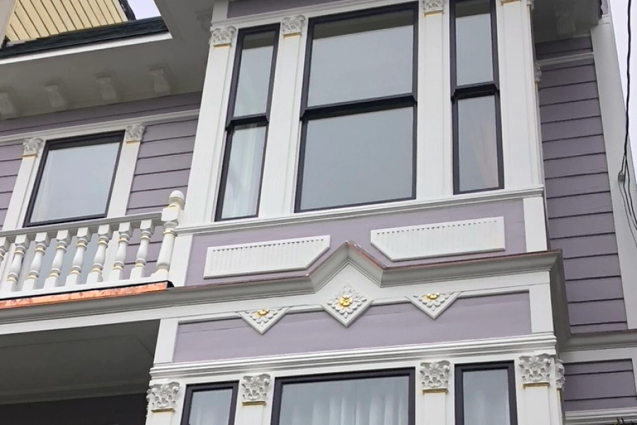 purple house with glass windows decorations and white frames